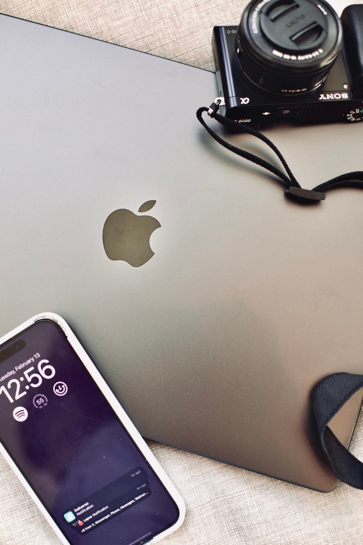 Laptop and phone on the Abode Marketing desk