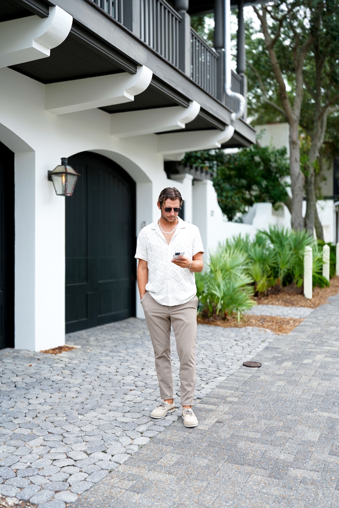 Independent insurance agent outside a coastal office