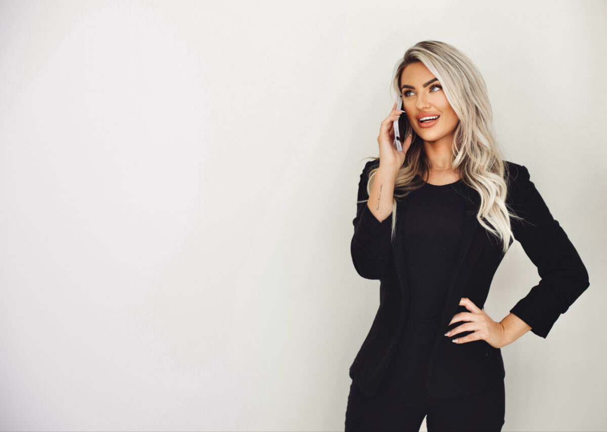 Kayce Sadler, founder of Abode Marketing, on a call