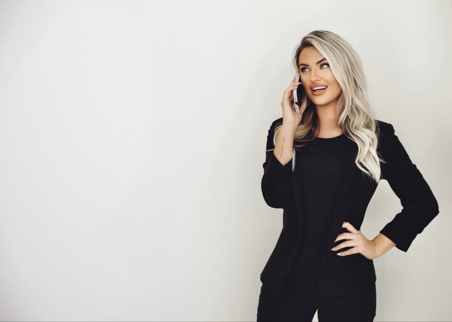 Kayce Sadler, founder of Abode Marketing, on a client call
