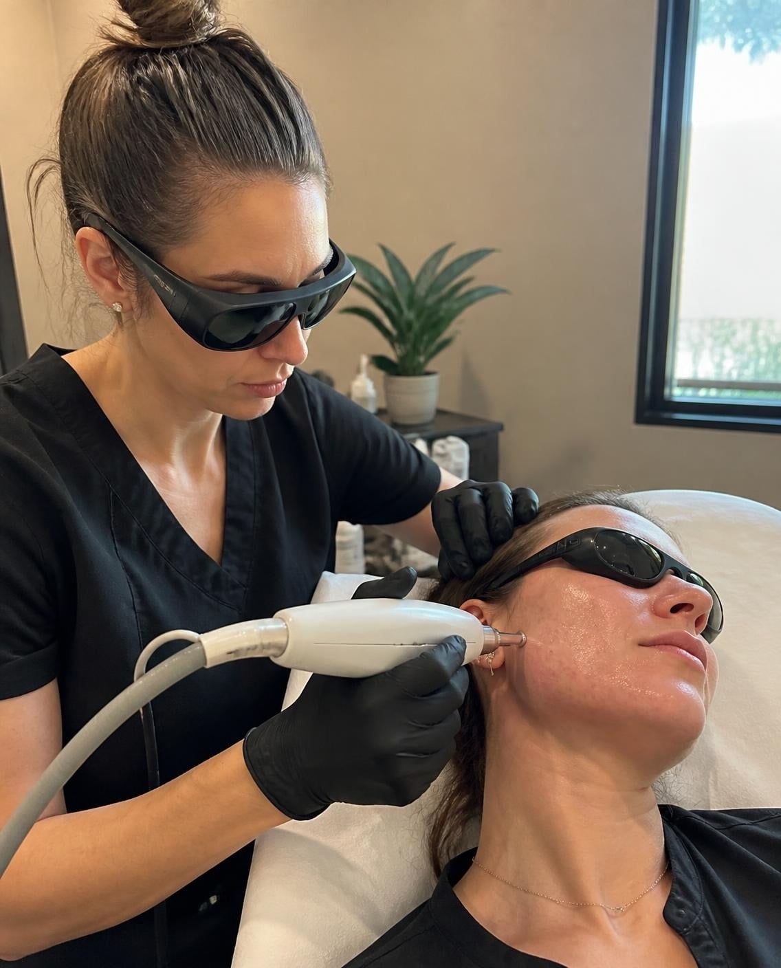 Med spa provider performing a laser skin treatment